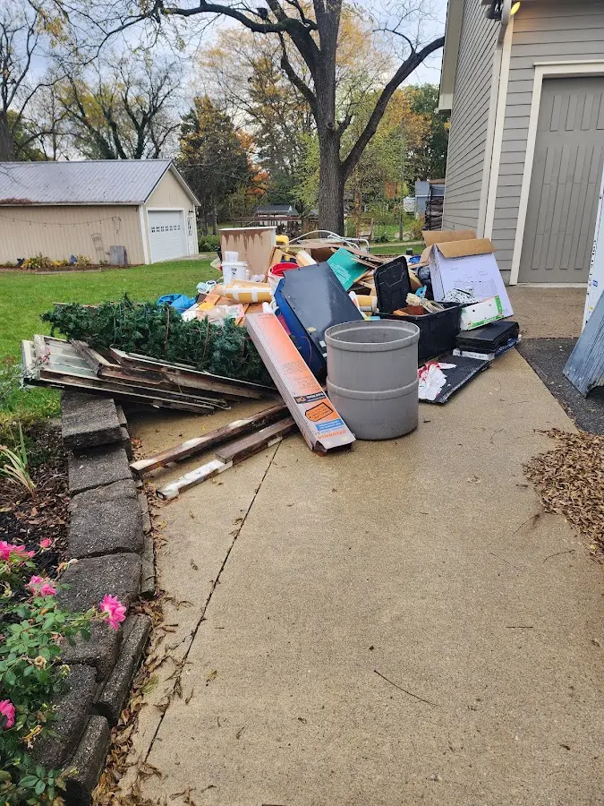 Dumpster being loaded with debris for Roofing Dumpster Rental in Fairport Harbor